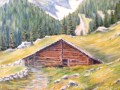 Paisaje alpino con cabaña y montañas